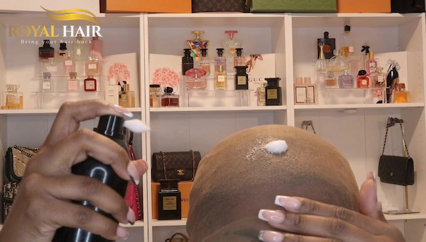 Spray the cap adhesive